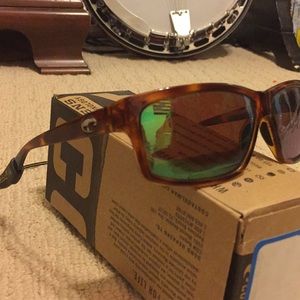 Costa Del Mar Cut : 580p Tortoise w/ green lenses.